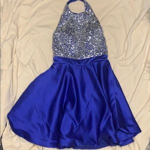 Sparkle and shine in this royal blue halter dress!